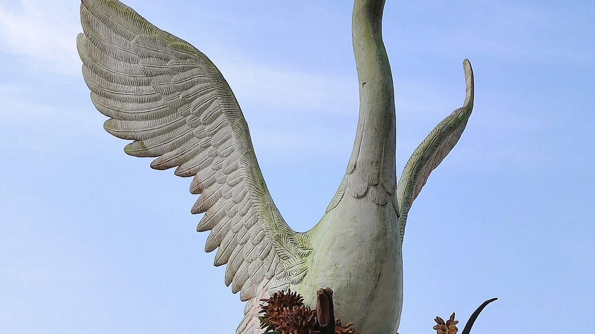 The Swan Monument and Rejang Esplanade — the waterfront the town is named for, at dusk